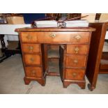 A Queen Anne kneehole desk