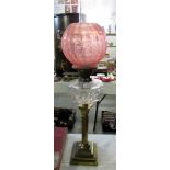 A Victorian brass corinthian column oil lamp with later shade