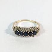 A 5 stone sapphire yellow gold ring,