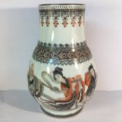 A circa 20th century vase featuring a sage and two attendants with calligraphy and seals,