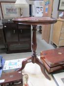 A mahogany tripod wine table with Tudor rose carved in top