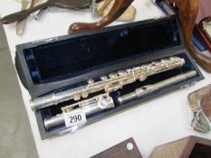A cased silver plate flute marked Trevor James