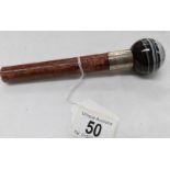 A walking stick handle with stone knop and silver band