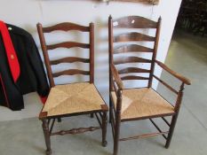 A ladder back carver chair and dining chair