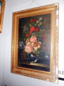 A gilt framed oil on canvas floral arrangement,