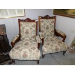 A pair of Edwardian arm chairs