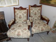 A pair of Edwardian arm chairs