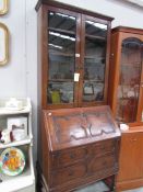 An oak bureau book case