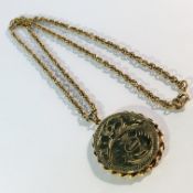 An engraved 9ct gold locket on 9ct gold chain, 16.