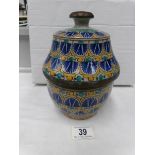 An art pottery hand painted lidded pot
