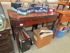 A mahogany fold over games/tea table