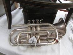 A cased Boosey and Hawkes trumpet