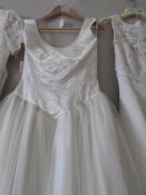 A Forever Yours ivory wedding gown with fitted bodice and full skirt with overlays,