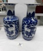 A pair of 19th century oriental blue and white vases,