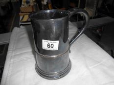 A Sheffield plate tankard with mahogany base