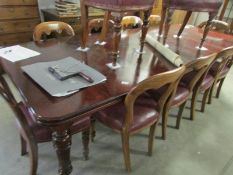 A mahogany wind out dining table (seats 12)