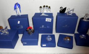 9 boxed Swarovski crystal items