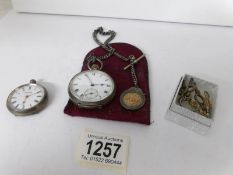 A silver pocket watch (requires attention) on silver chain and a ladies 800 silver fob watch with