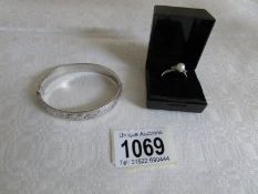 A silver ring set cultured pearl and a silver bangle
