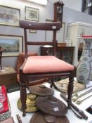 A mahogany bar back chair