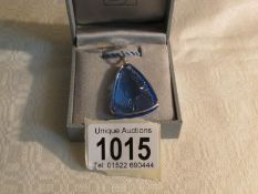A Lalique blue glass pendant