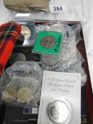 A collection of coins including £5 commemoratives