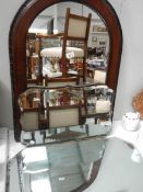 An oak framed and 2 1940's bevel edged mirrors