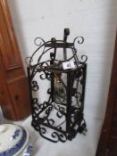 A wrought iron hall light