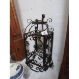 A wrought iron hall light