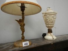 A cherub table lamp and a lamp base