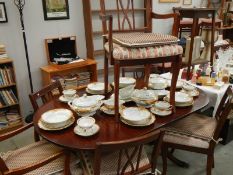 An oval dining table and 6 chairs