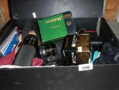 A mixed lot of 35mm camera equipment including various lenses