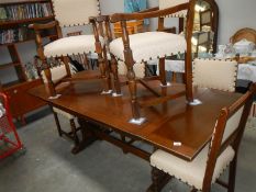 A draw leaf table and 6 chairs