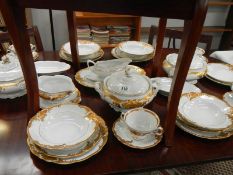 Approximately 36 pieces of gold decorated table ware
