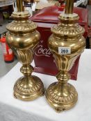 A pair of brass table lamp bases