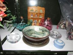 A shelf of glass ware,