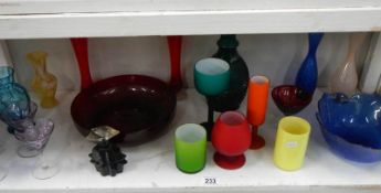 A shelf of coloured glass