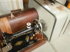 An original vintage cased Singer sewing machine and an original Bernina record 530-2 case with keys