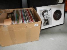 A quantity of 45rpm and LP records and framed 45 with photograph of Cliff Richard