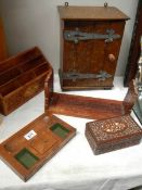 A wooden cabinet, letter rack,