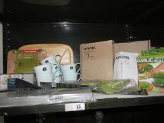 A shelf of new kitchen items including table lamp