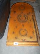 A vintage bagatelle board and balls