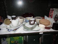 A shelf of miscellaneous kitchen ware including jelly moulds