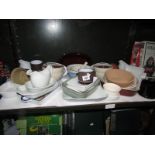 A shelf of miscellaneous kitchen ware including jelly moulds