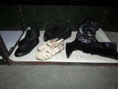 A shelf of boots and shoes