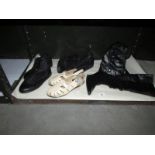 A shelf of boots and shoes