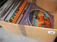 A collection of LP and 12" records including 10cc, The Eagles,