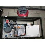 A pet carrier, fan heater,