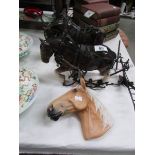 2 horse figures and a horse head figure