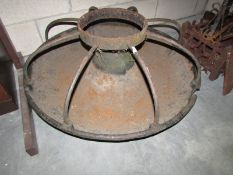An old iron pig feeding trough